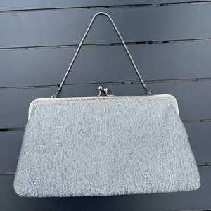 Vintage silver clutch purse. Width, from 8.5-10 inches, 5.5 inches tall.